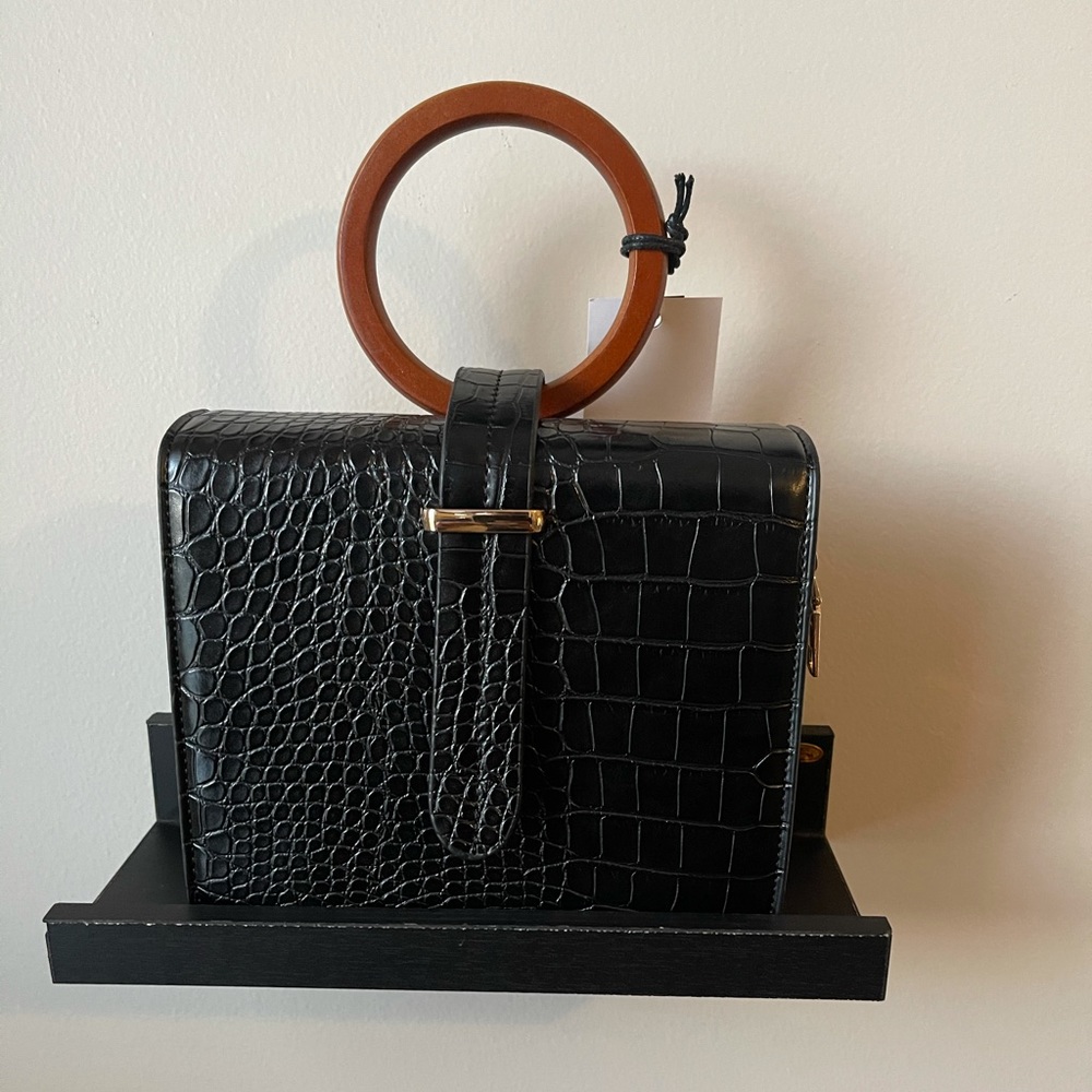 Black textured handbag